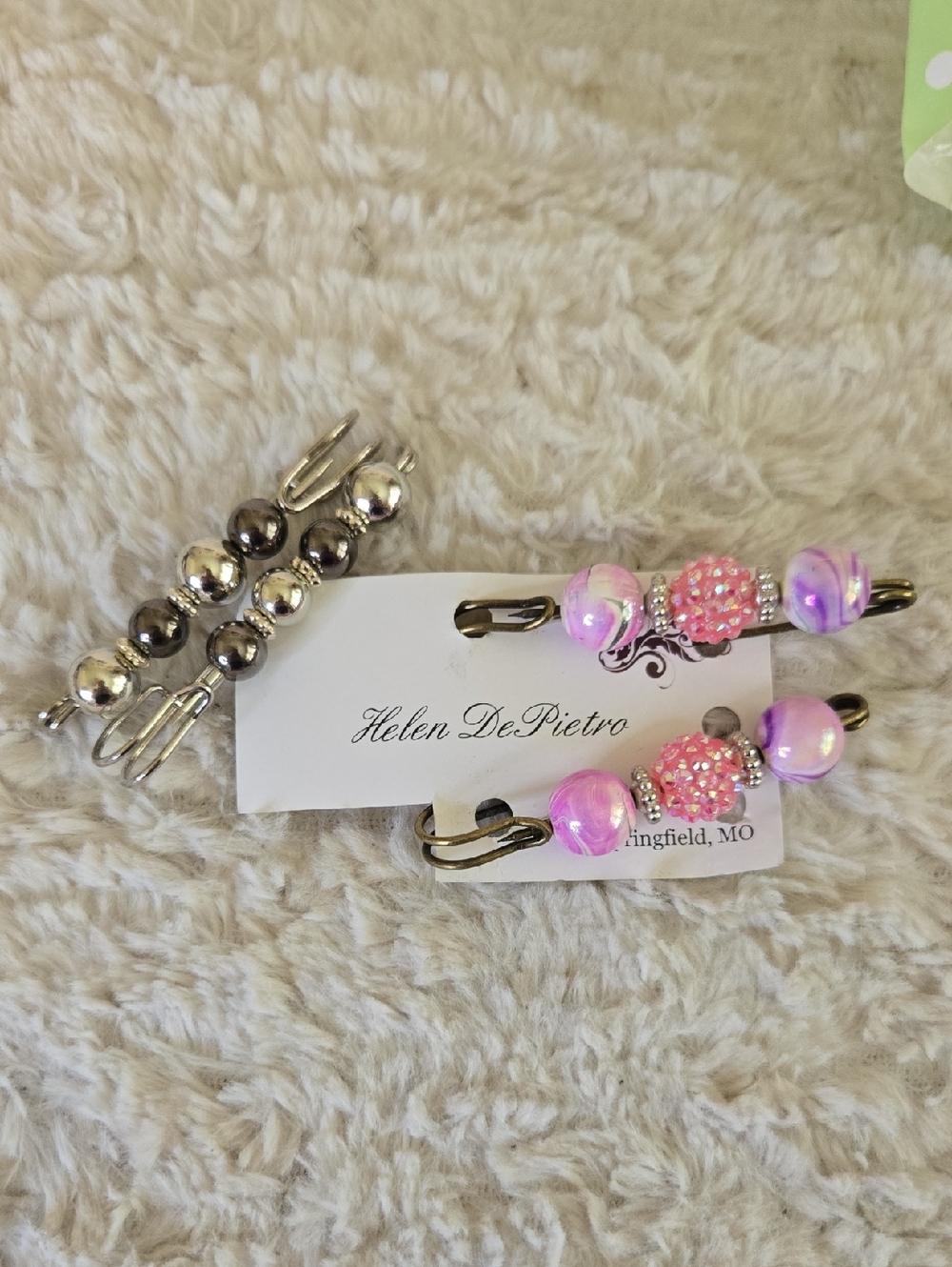 Pink And Brown Pins For Many Things Includig Clothes Purses Ect.